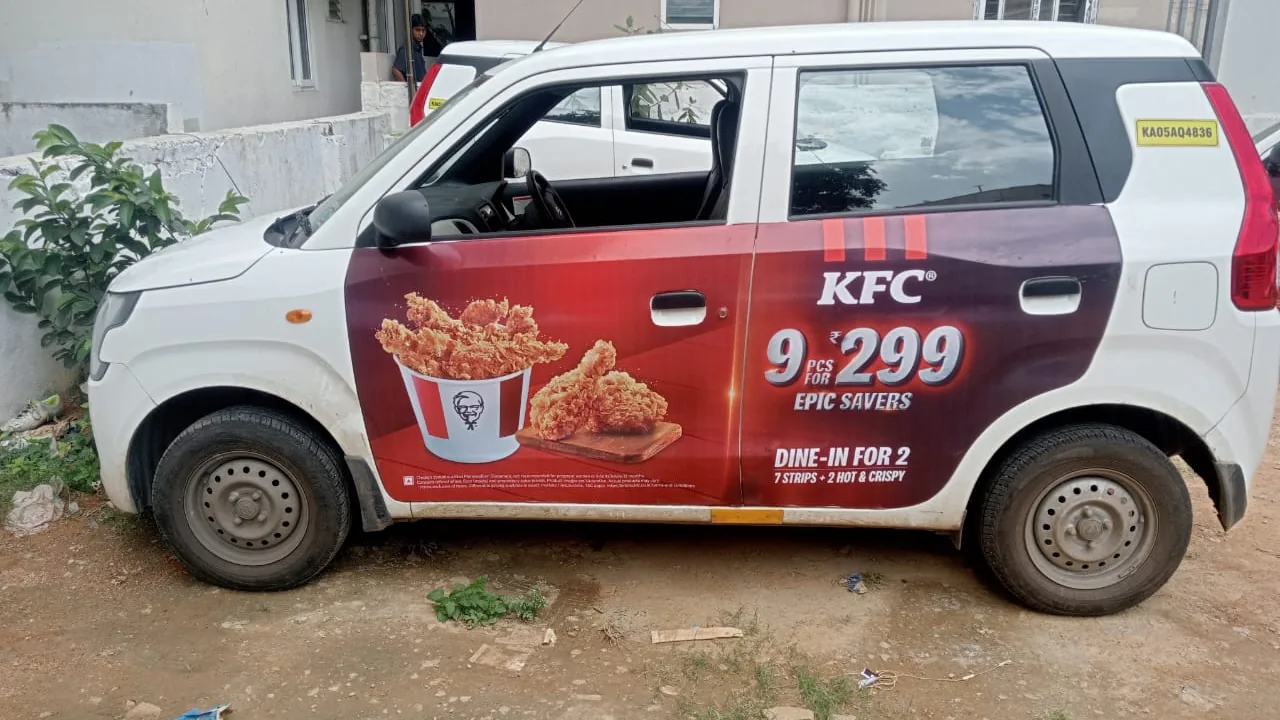 LetzRyd WagonR wrapped in a KFC ad for its 9 for 299 meal deal